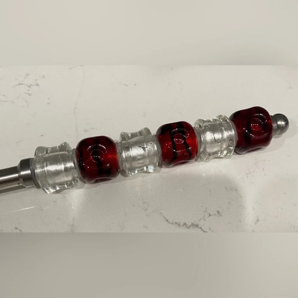 The Pampered Chef Stainless Steel Spoon with Red Accents